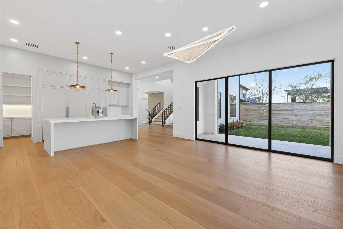 6534 Corbin Street Houston, TX 77055 - Photo 4 of 50 a view of an empty room with window and wooden floor