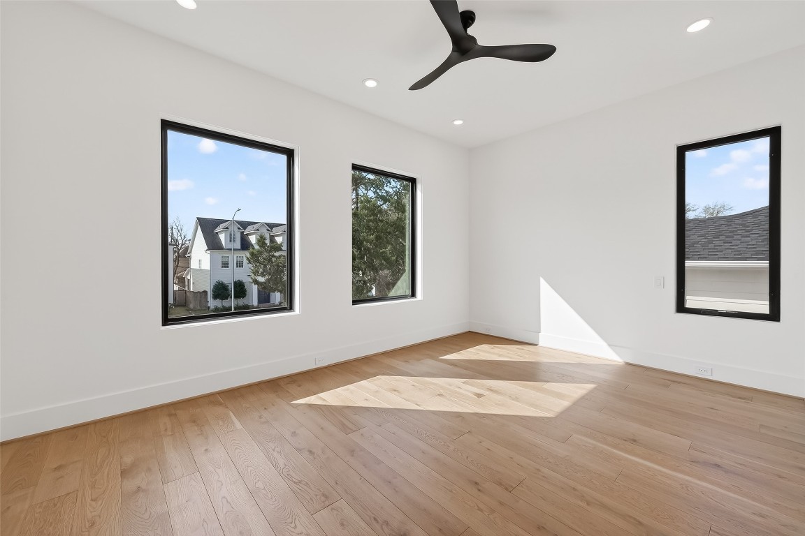 6534 Corbin Street Houston, TX 77055 - Photo 41 of 50 a view of an empty room with wooden floor and window