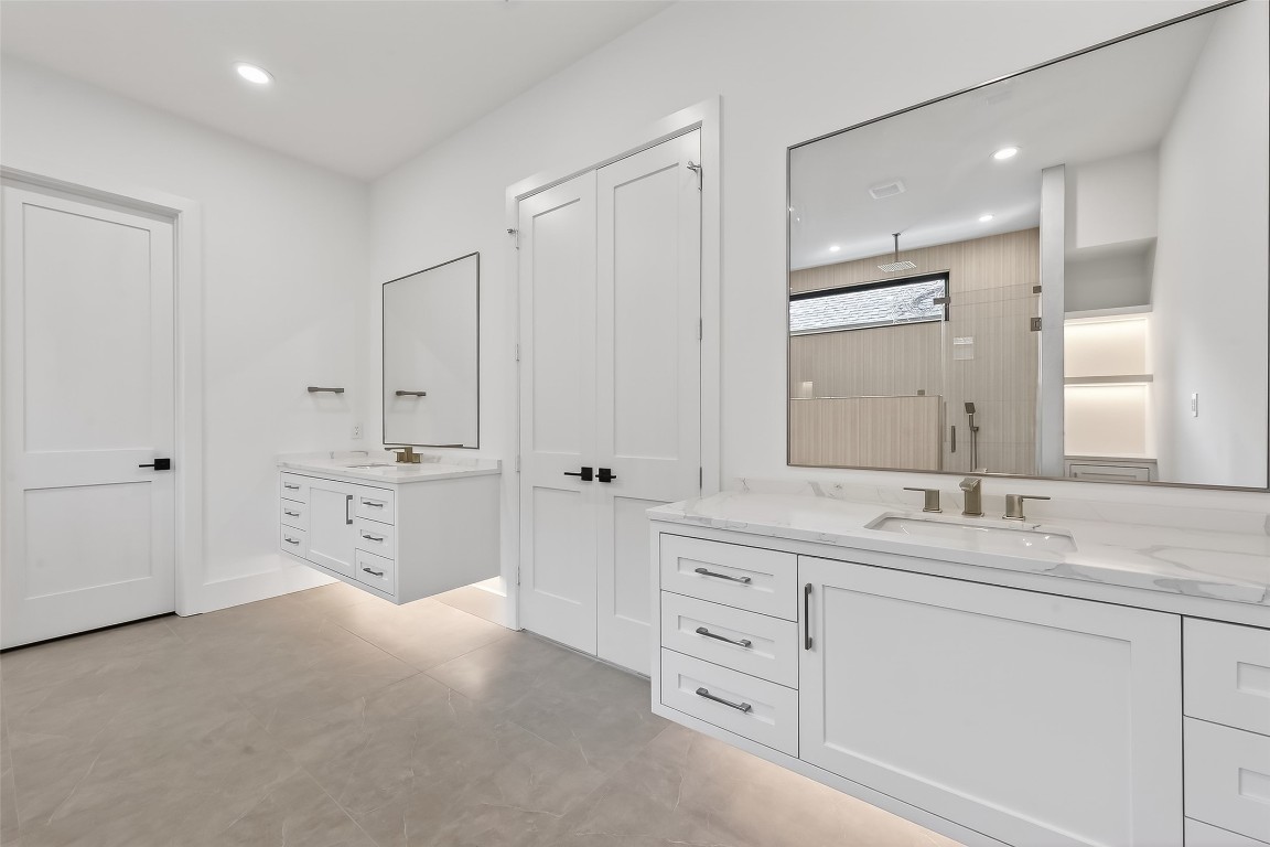 6534 Corbin Street Houston, TX 77055 - Photo 45 of 50 a spacious bathroom with double sink and a mirror