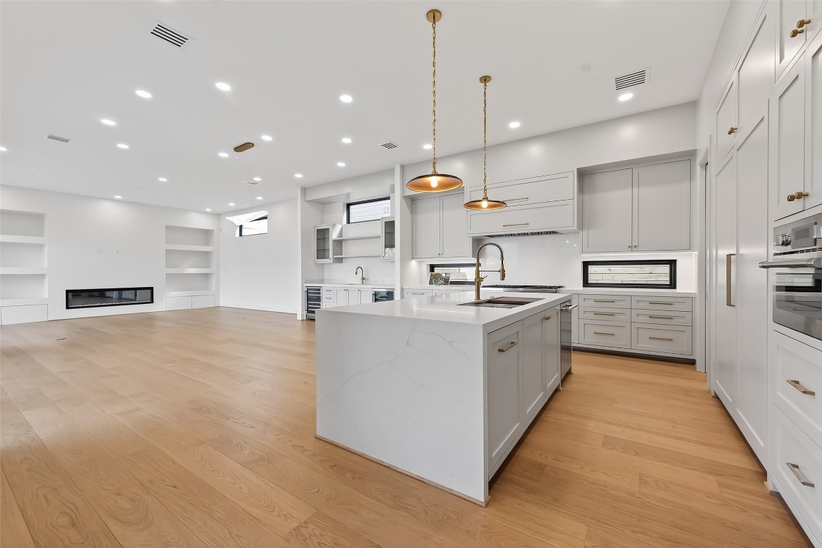6534 Corbin Street Houston, TX 77055 - Photo 50 of 50 a large kitchen with stainless steel appliances kitchen island a large counter top and a stove