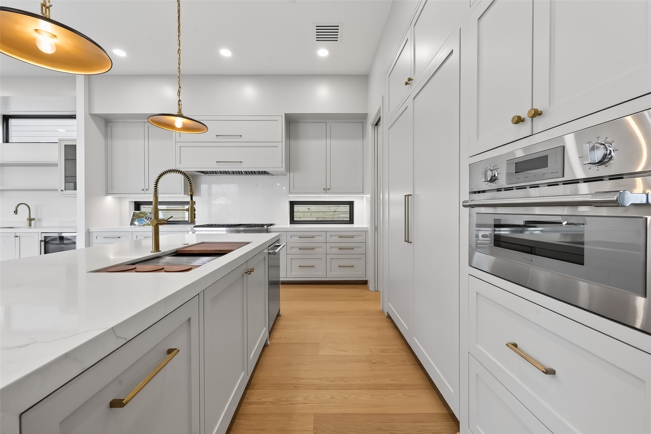 6534 Corbin Street Houston, TX 77055 - Photo 7 of 50 Spacious kitchen with stainless steel appliances and modern waterfall island.