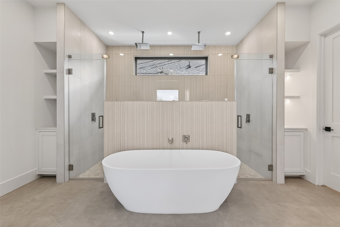 6534 Corbin Street Houston, TX 77055 - Photo 9 of 50 a bathroom with a bathtub and a shower