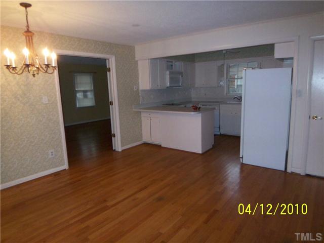 218 Northfield Drive Raleigh, NC 27609 - Photo 2 of 7 a kitchen with a refrigerator and a stove
