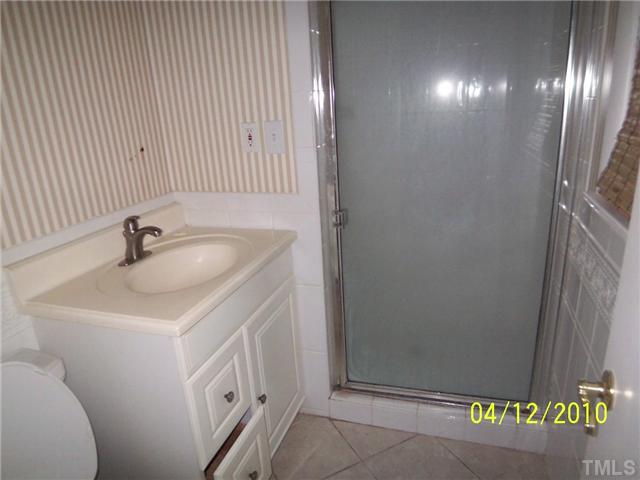 218 Northfield Drive Raleigh, NC 27609 - Photo 5 of 7 a bathroom with a sink and a mirror