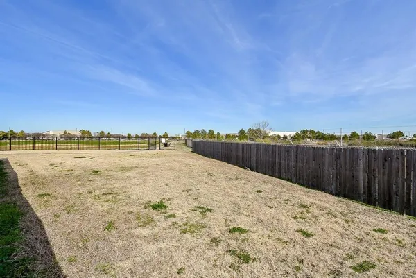 a view of a backyard of the house