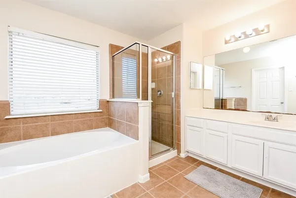 a bathroom with a bathtub and a sink