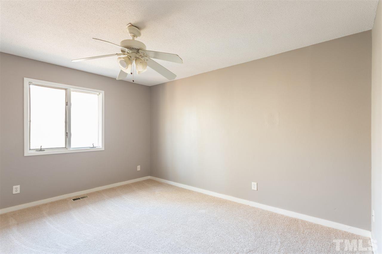 2004 Brocton Place Durham, NC 27712 - Photo 12 of 29 an empty room with a window and a fan