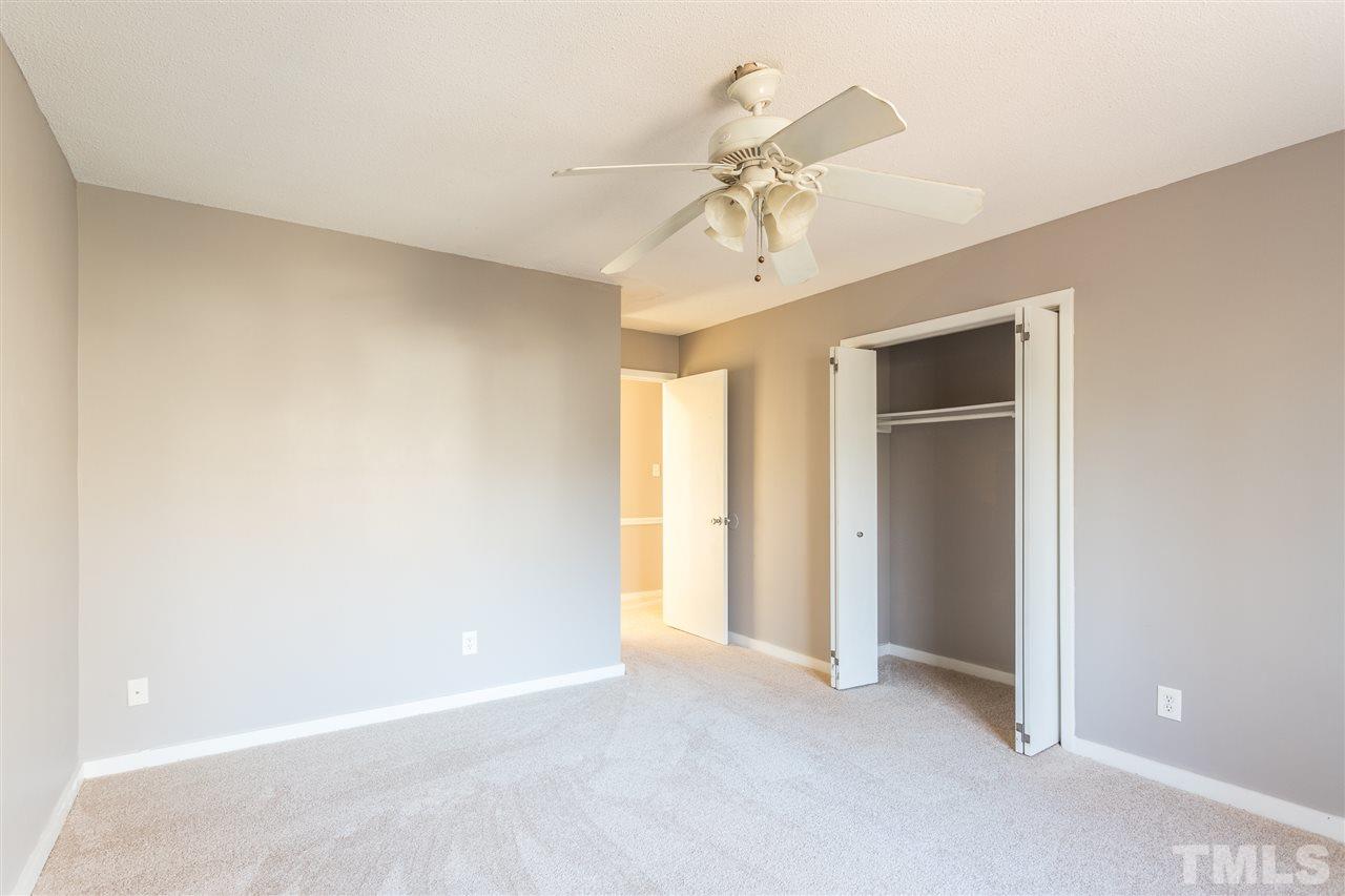 2004 Brocton Place Durham, NC 27712 - Photo 13 of 29 an empty room with a chandelier fan and entryway
