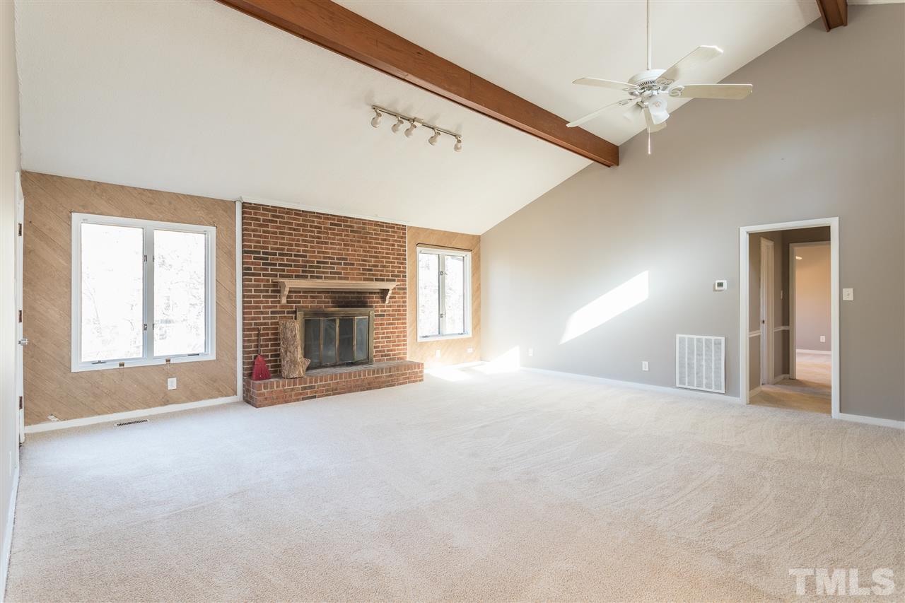 2004 Brocton Place Durham, NC 27712 - Photo 3 of 29 a view of empty room with window and fireplace
