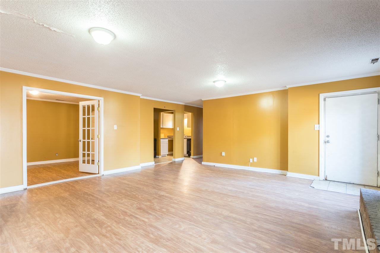 2004 Brocton Place Durham, NC 27712 - Photo 22 of 29 a view of an empty room with wooden floor and a window