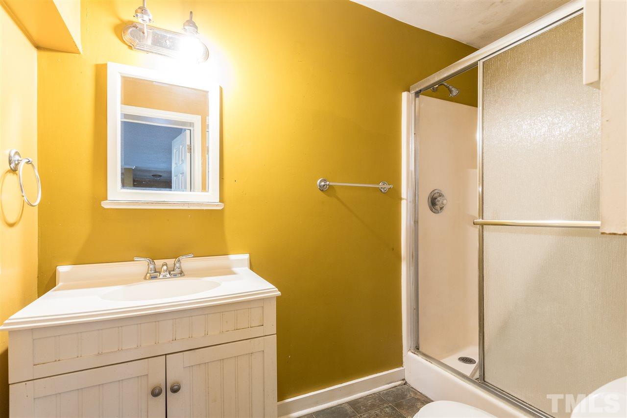 2004 Brocton Place Durham, NC 27712 - Photo 23 of 29 a bathroom with a sink and mirror