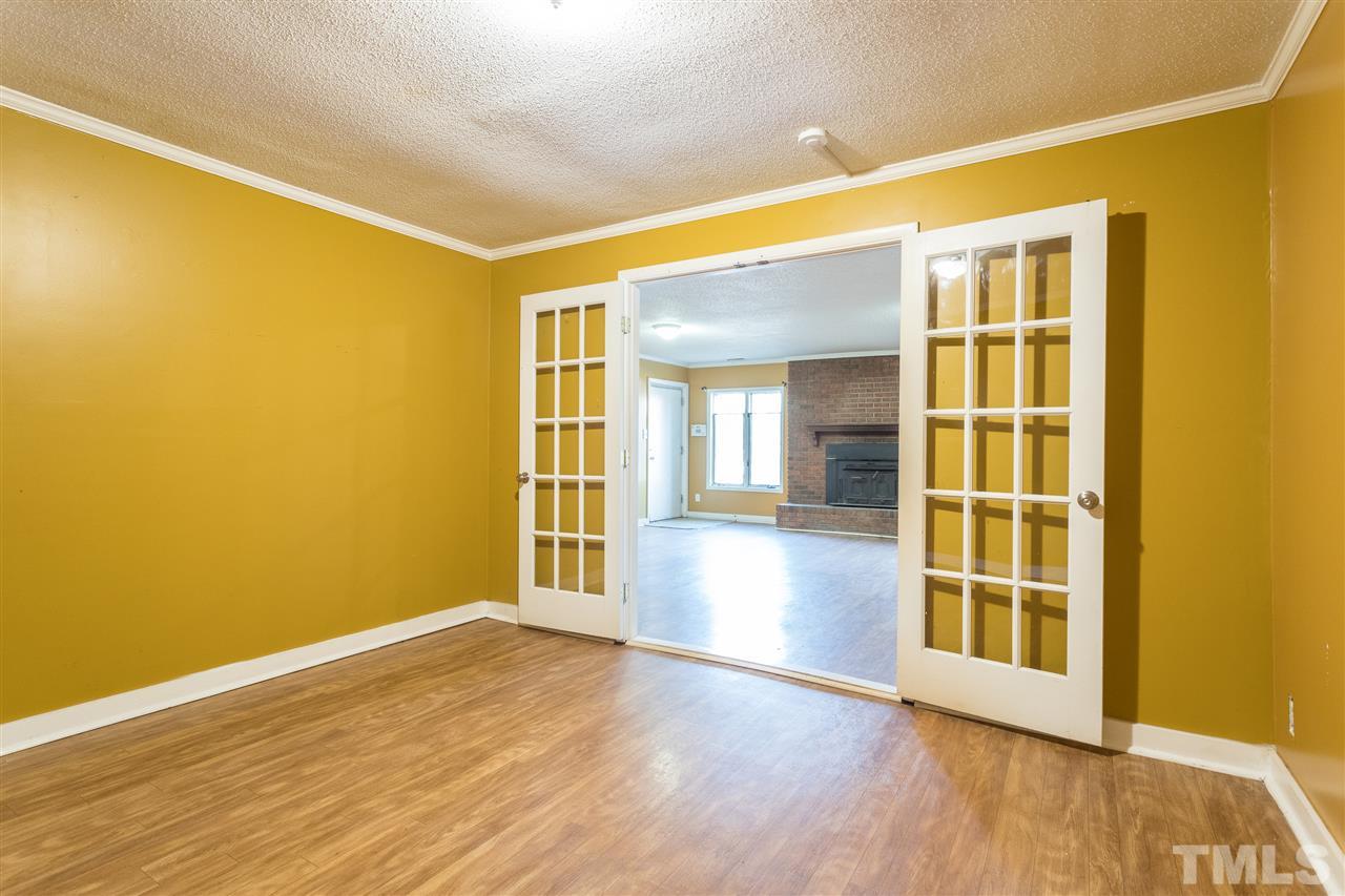 2004 Brocton Place Durham, NC 27712 - Photo 24 of 29 a view of empty room with wooden floor and fan