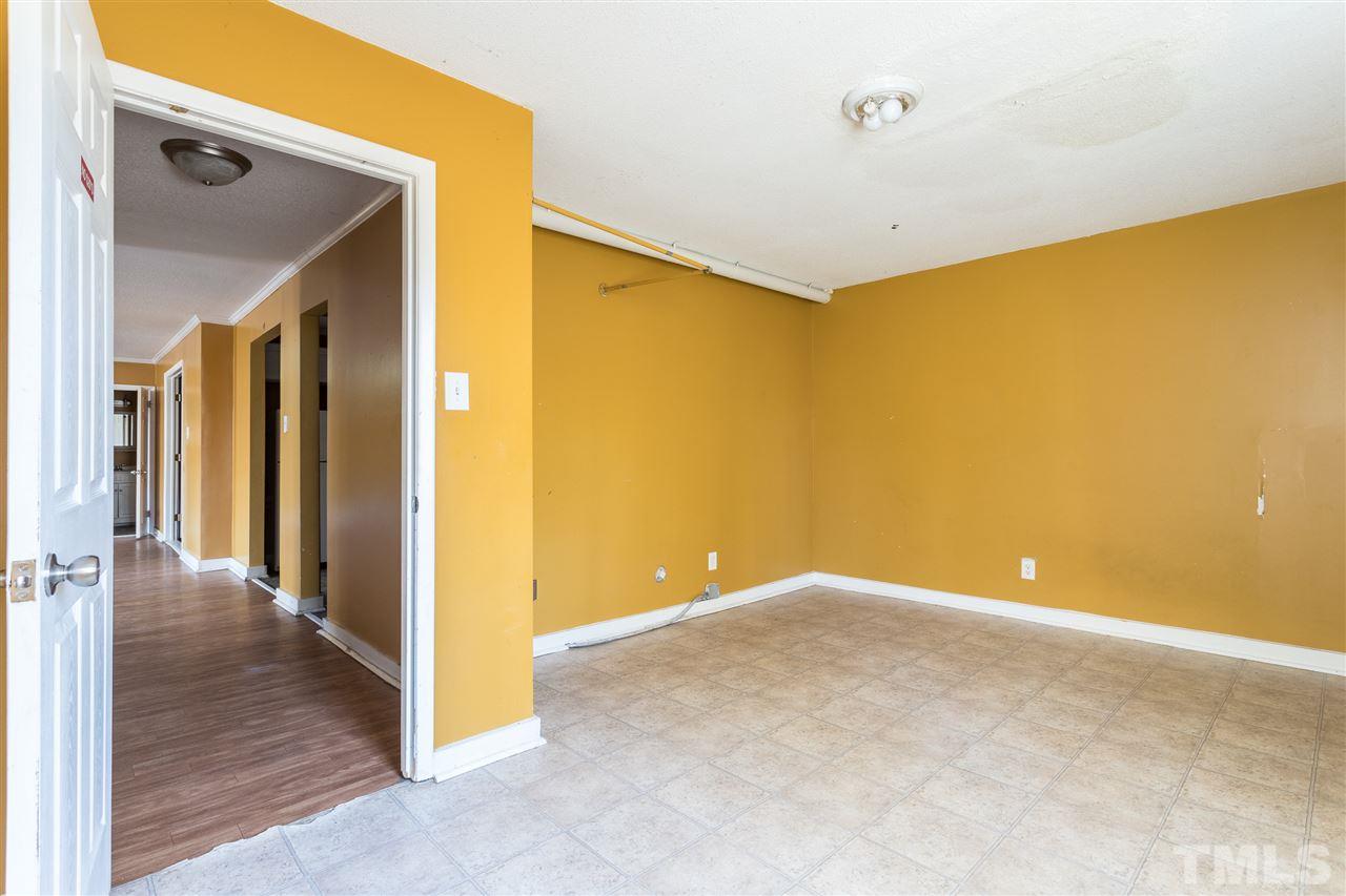 2004 Brocton Place Durham, NC 27712 - Photo 28 of 29 a view of a big room with wooden floor and brick walls