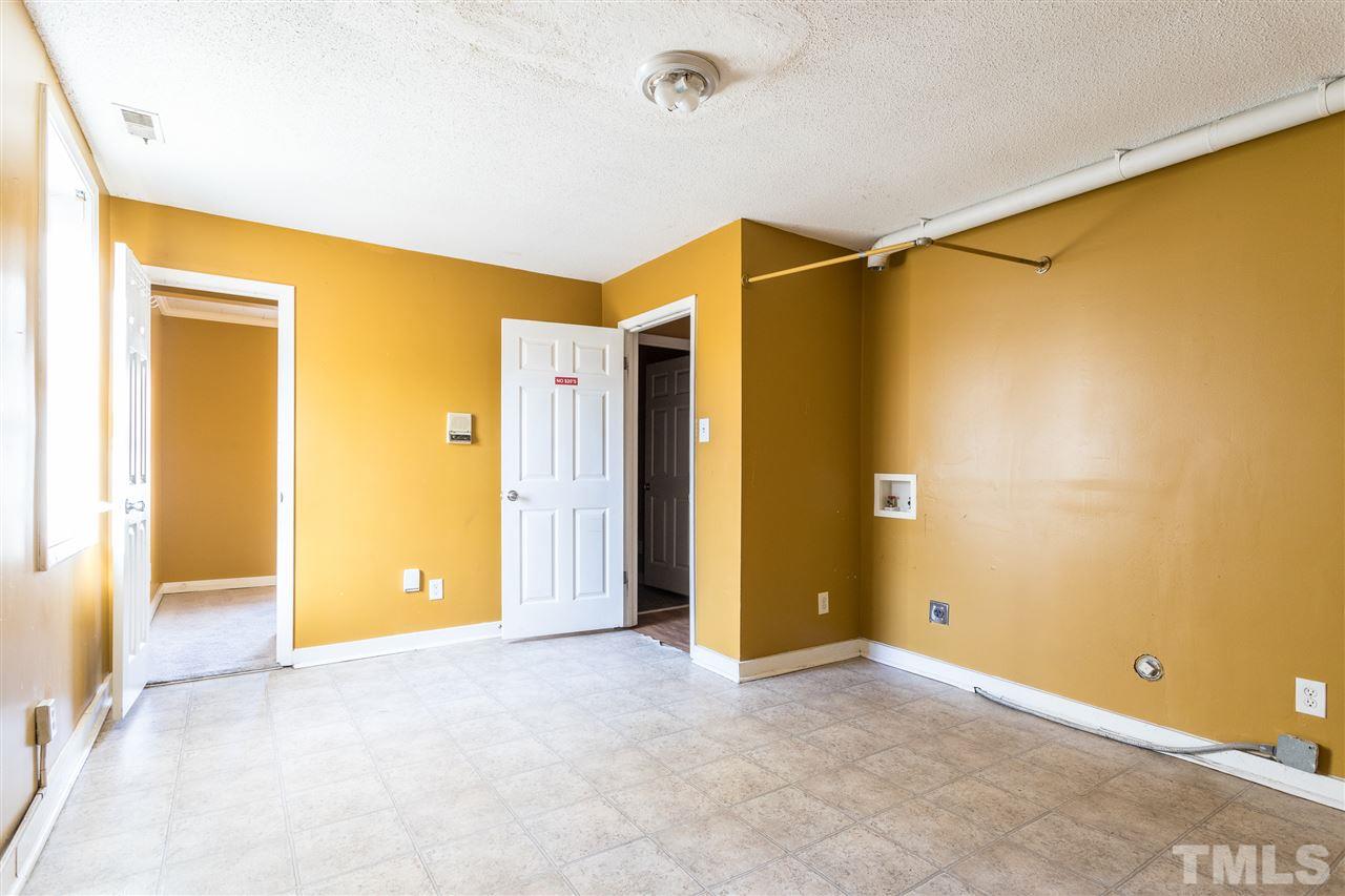 2004 Brocton Place Durham, NC 27712 - Photo 29 of 29 a view of a big room with closet and wooden floor