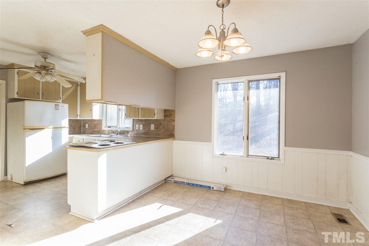 2004 Brocton Place Durham, NC 27712 - Photo 6 of 29 a kitchen with stainless steel appliances granite countertop a sink and a stove