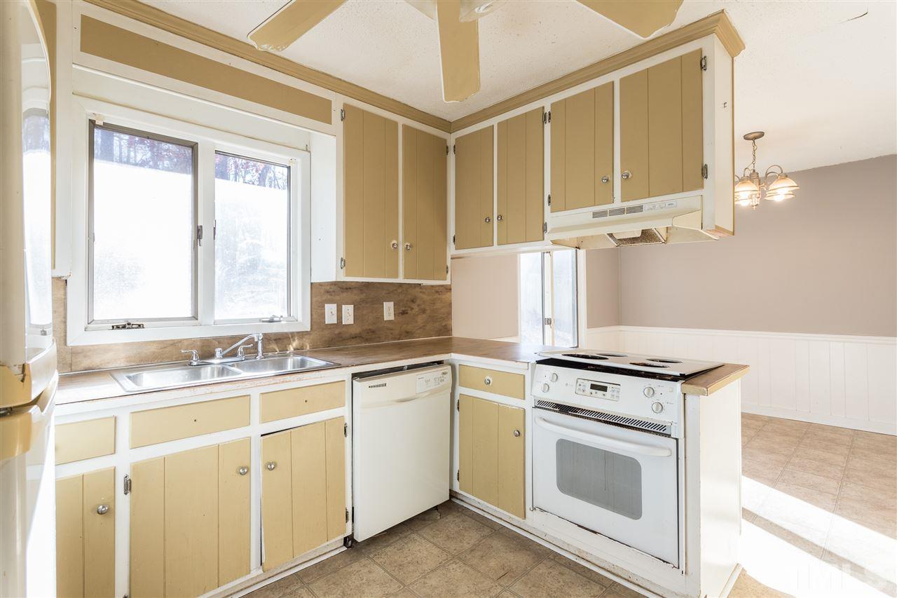 2004 Brocton Place Durham, NC 27712 - Photo 7 of 29 a kitchen with cabinets appliances a sink and a window