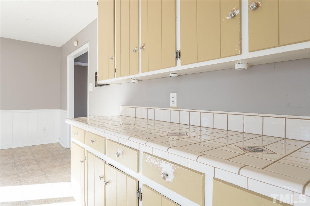 2004 Brocton Place Durham, NC 27712 - Photo 9 of 29 a kitchen with a sink and cabinets