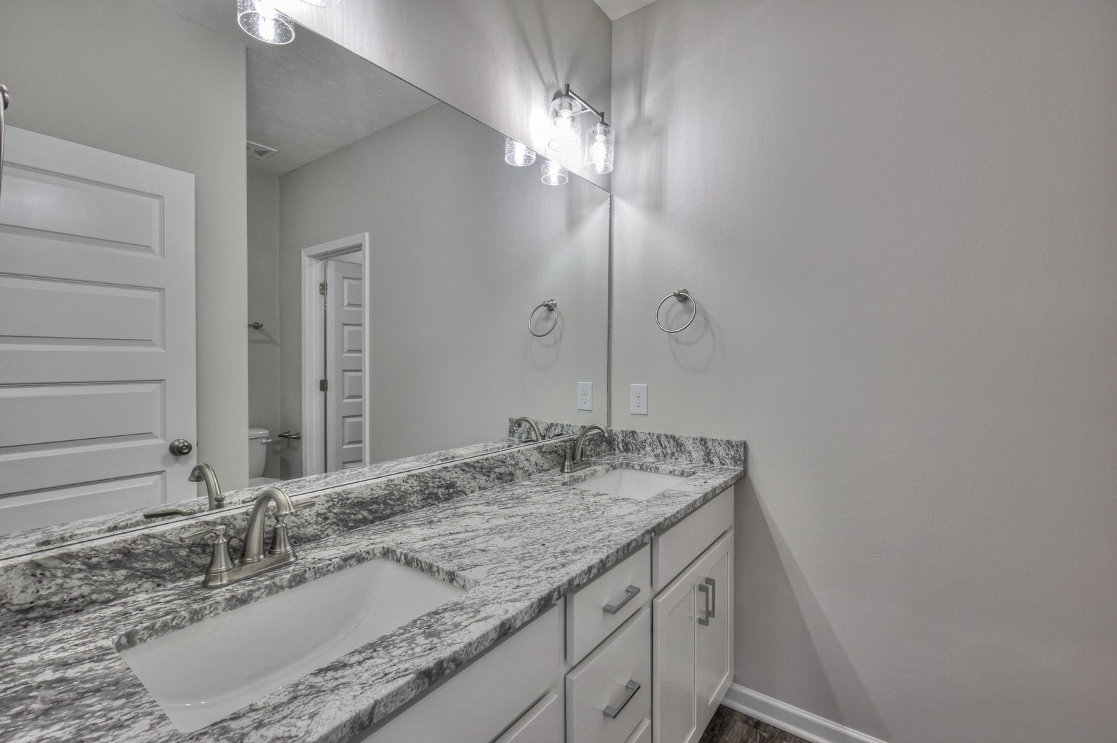 113 Creek Wood Road Manchester, TN 37355 - Photo 20 of 37 a bathroom with a granite countertop double vanity and a mirror