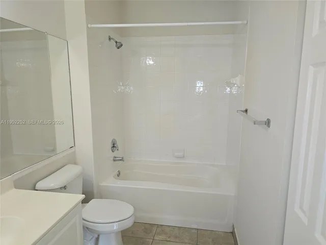 a bathroom with a toilet and a bathtub