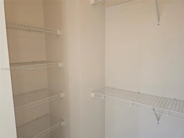 a view of an empty walk in closet