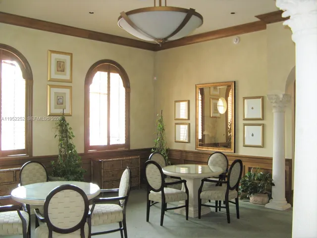 a front view of a house with wooden floor and furniture