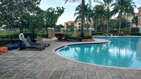 a view of a swimming pool with a patio