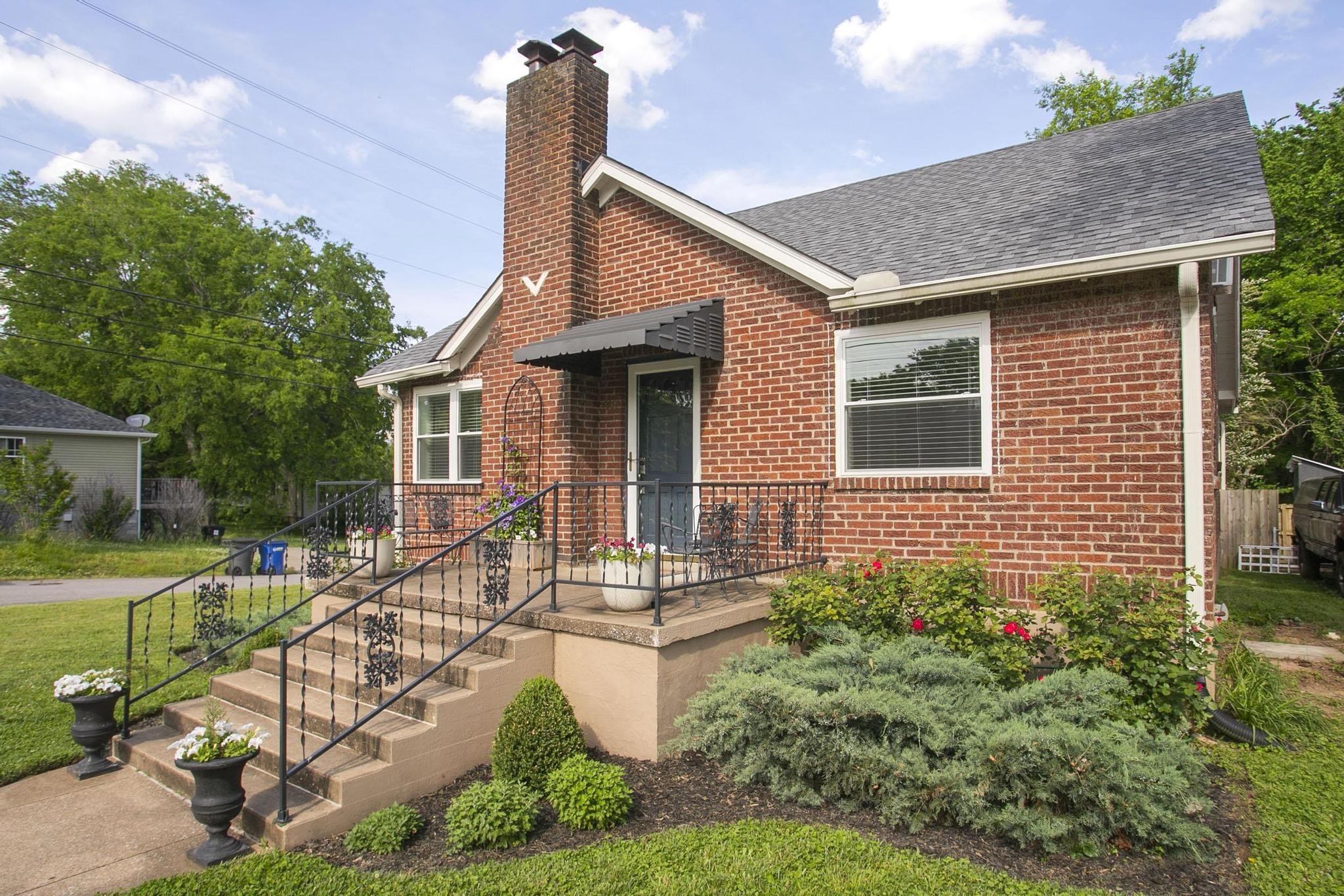 806 Fleming Street Columbia, TN 38401 - Photo 1 of 54 a house view with a garden and pool