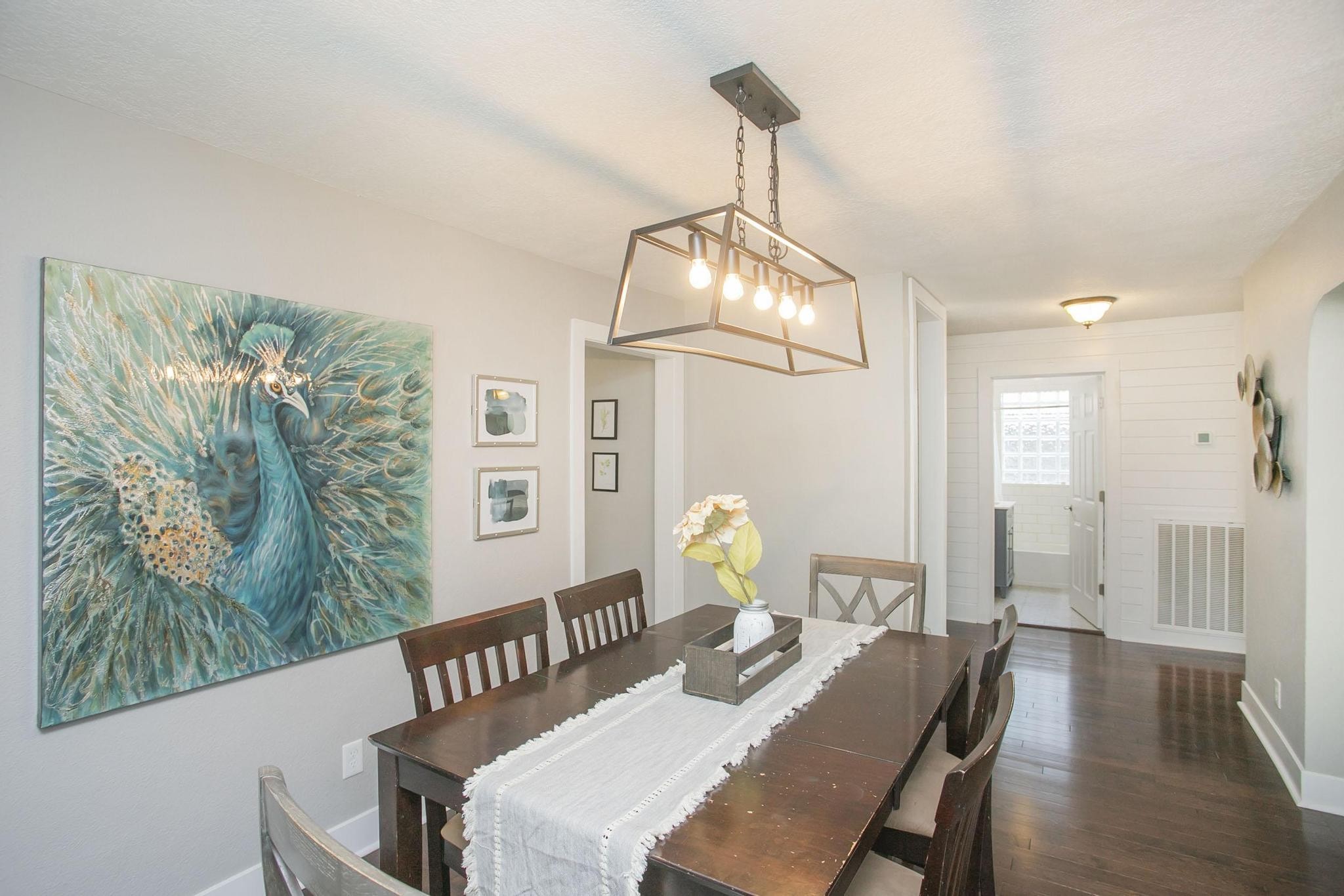 806 Fleming Street Columbia, TN 38401 - Photo 11 of 54 a view of a dining room with furniture a chandelier and wooden floor