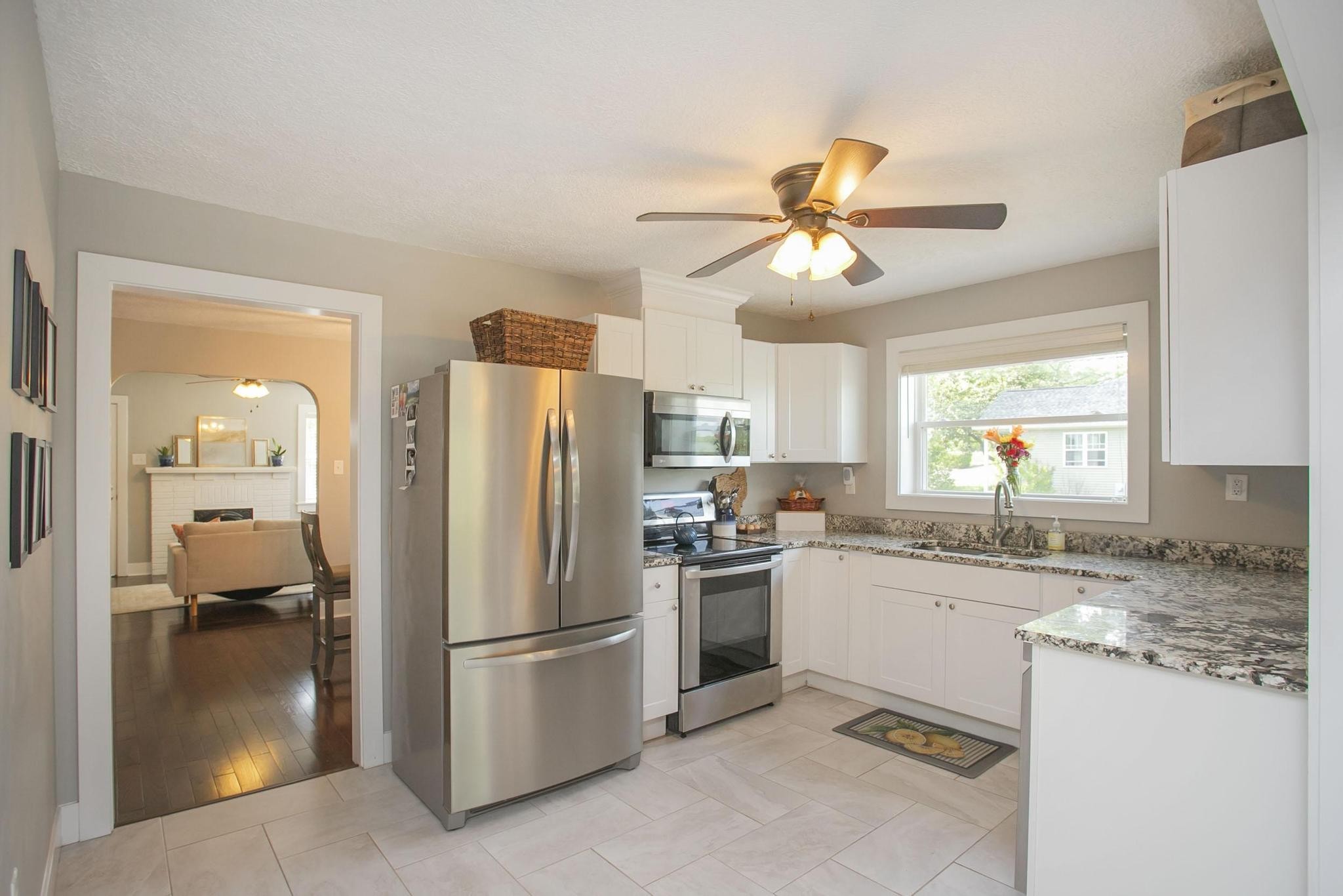 806 Fleming Street Columbia, TN 38401 - Photo 14 of 54 a kitchen with a refrigerator a sink a stove and cabinets