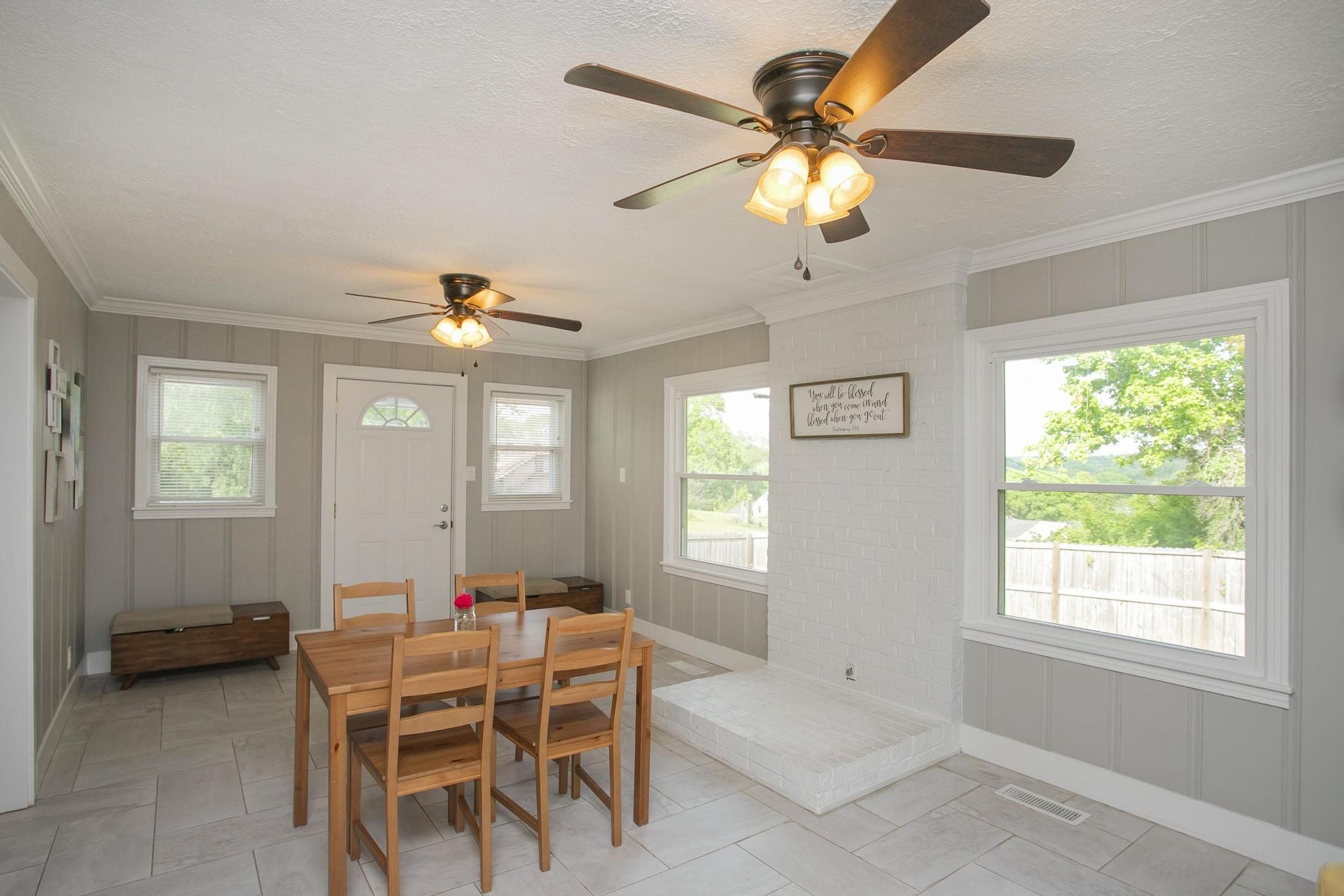 806 Fleming Street Columbia, TN 38401 - Photo 19 of 54 a dining room with chandelier fan and wooden floor