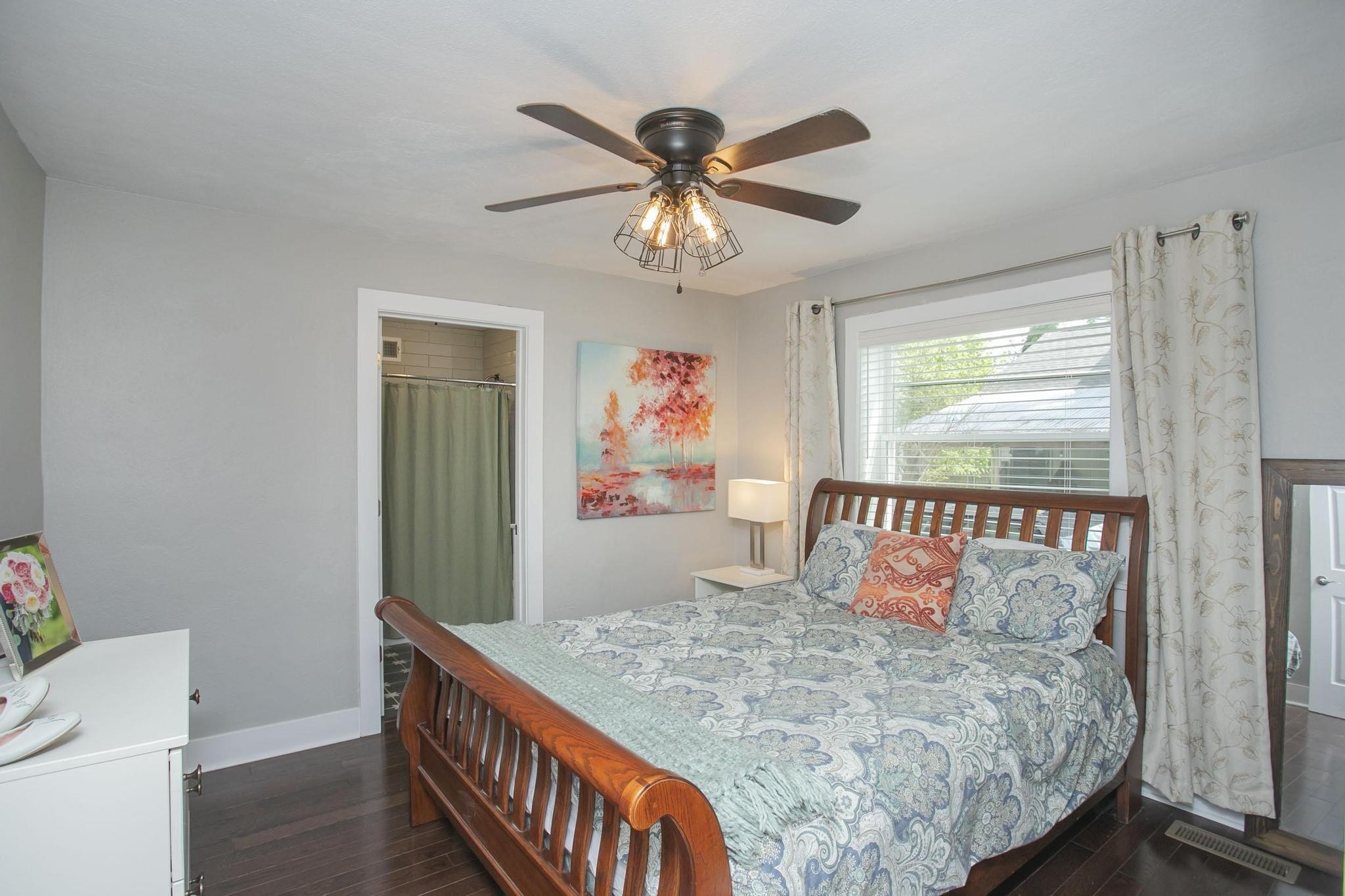 806 Fleming Street Columbia, TN 38401 - Photo 22 of 54 a bed sitting in a bedroom next to a window