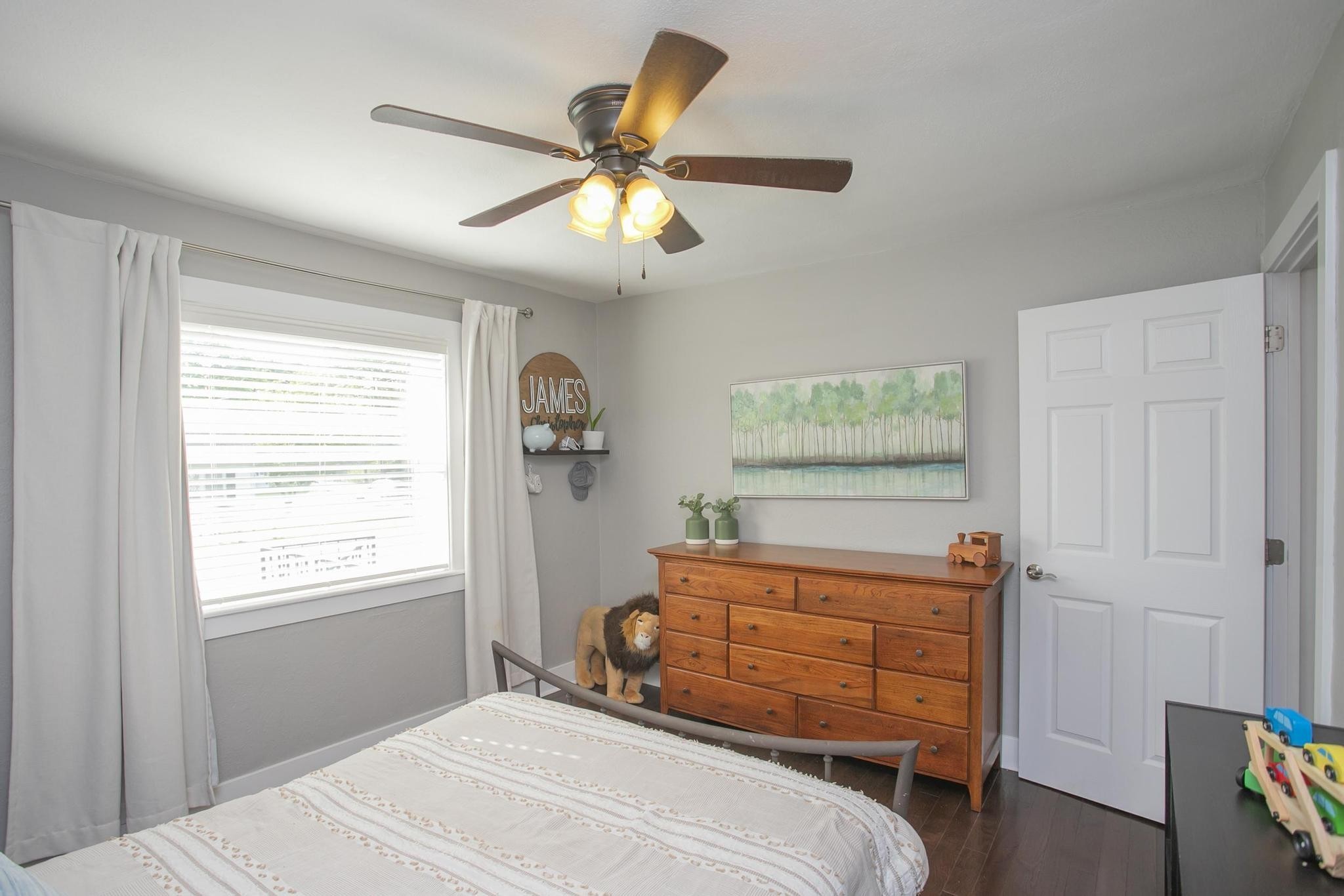 806 Fleming Street Columbia, TN 38401 - Photo 28 of 54 a bedroom with a bed and a chandelier