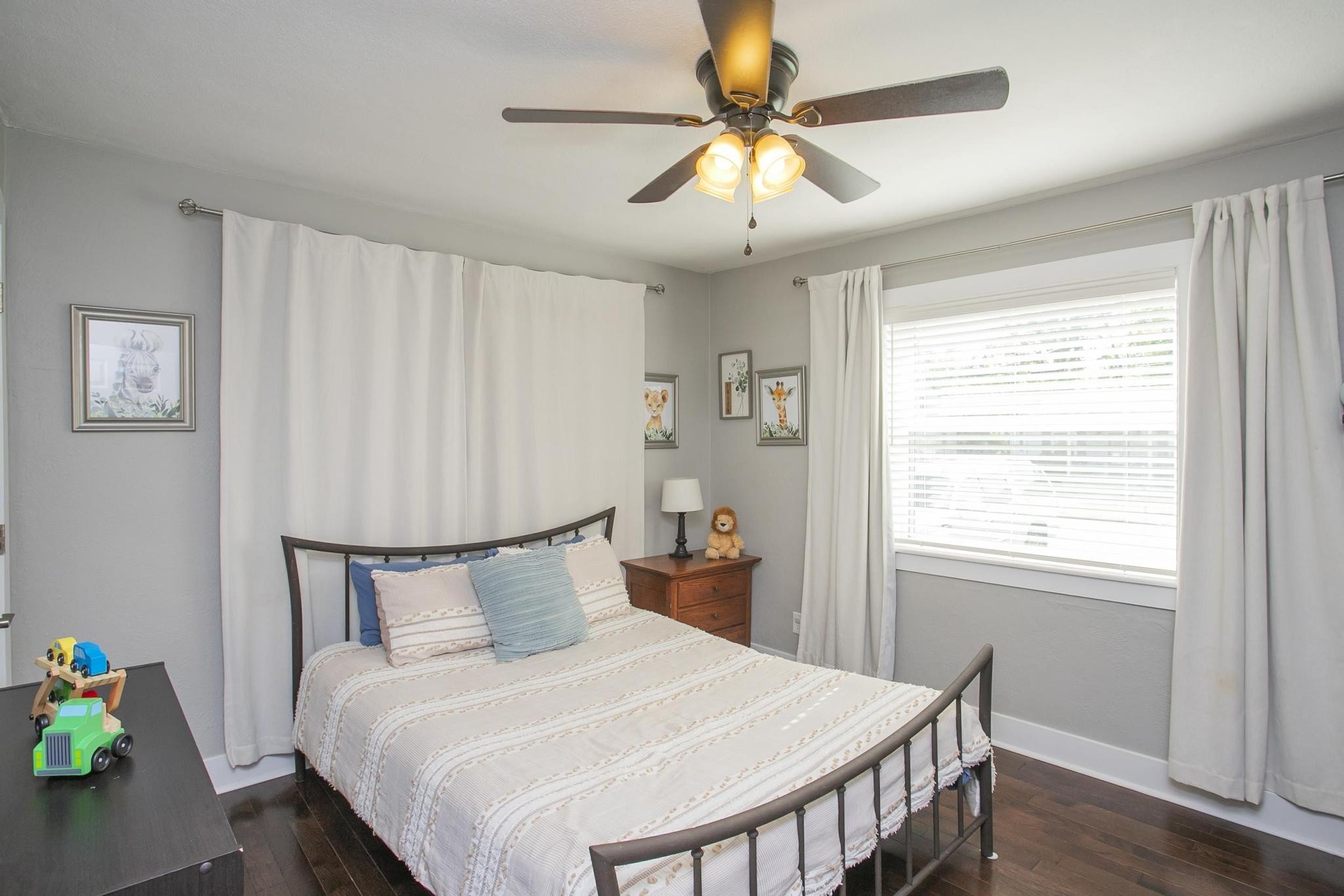 806 Fleming Street Columbia, TN 38401 - Photo 29 of 54 a bedroom with a bed and a chandelier