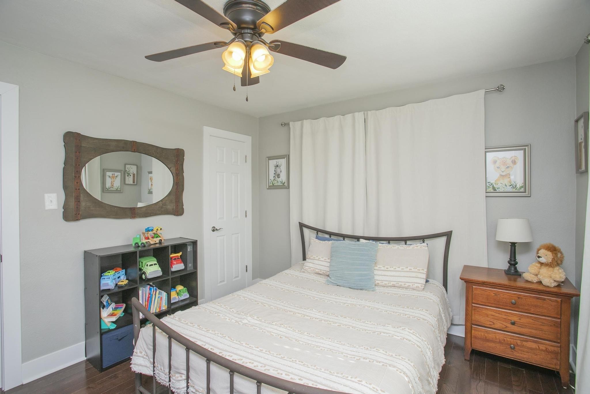 806 Fleming Street Columbia, TN 38401 - Photo 31 of 54 a bedroom with a bed and a chandelier