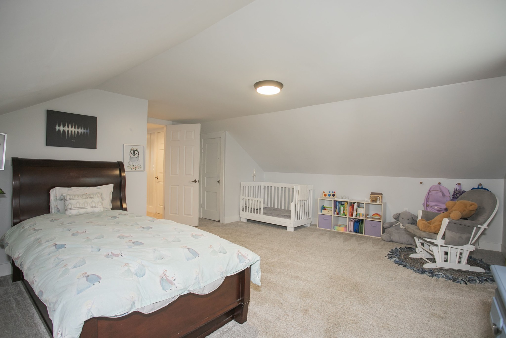 806 Fleming Street Columbia, TN 38401 - Photo 40 of 54 a bedroom with a bed a chair and potted plant on the dresser