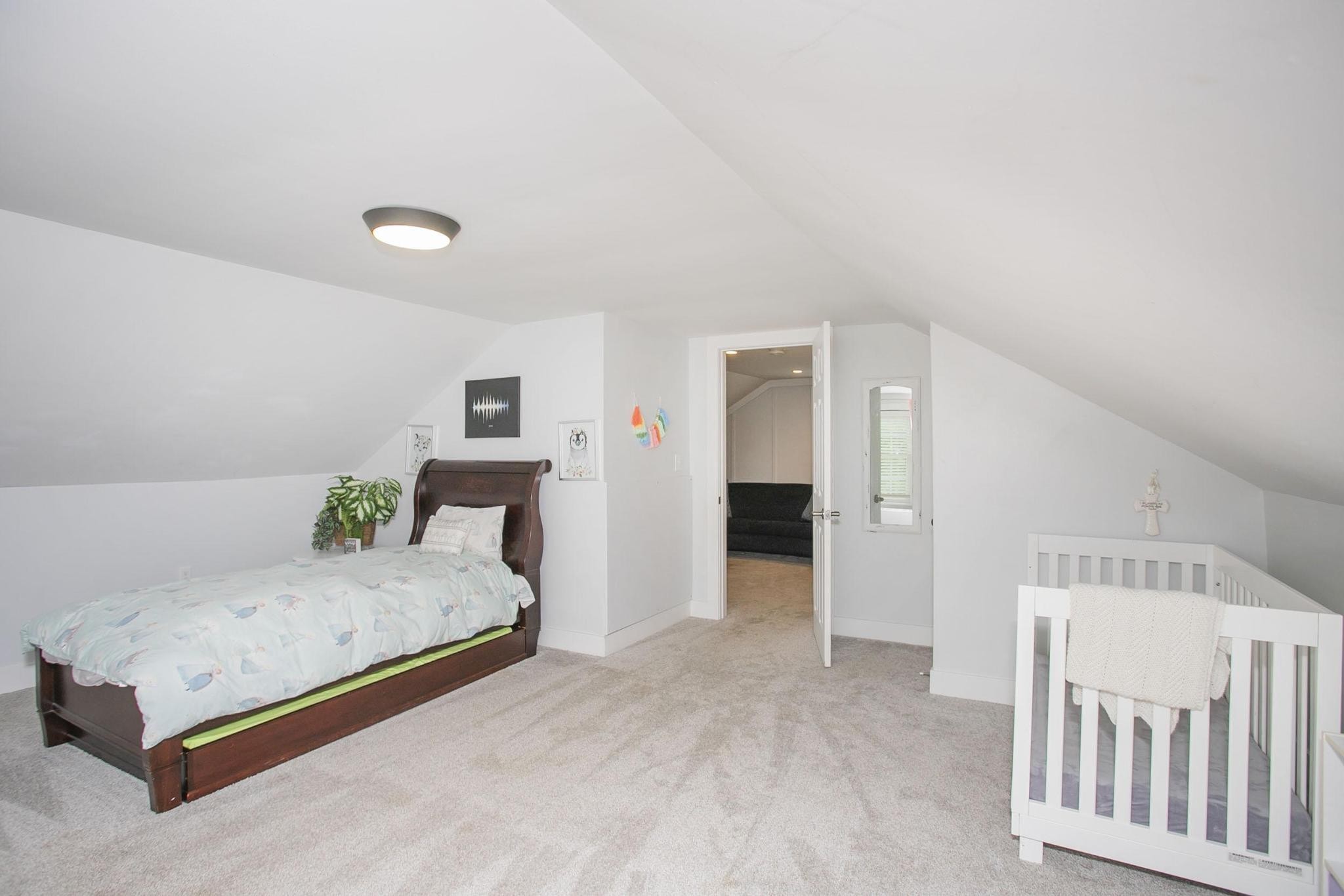 806 Fleming Street Columbia, TN 38401 - Photo 42 of 54 a spacious bedroom with a bed and cabinets