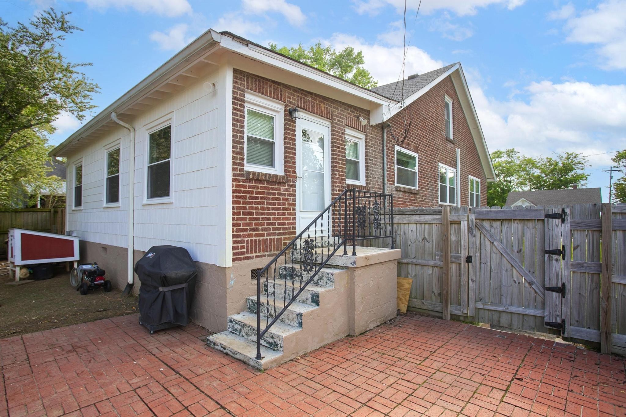 806 Fleming Street Columbia, TN 38401 - Photo 47 of 54 a view of a house with a barbeque and wooden stairs
