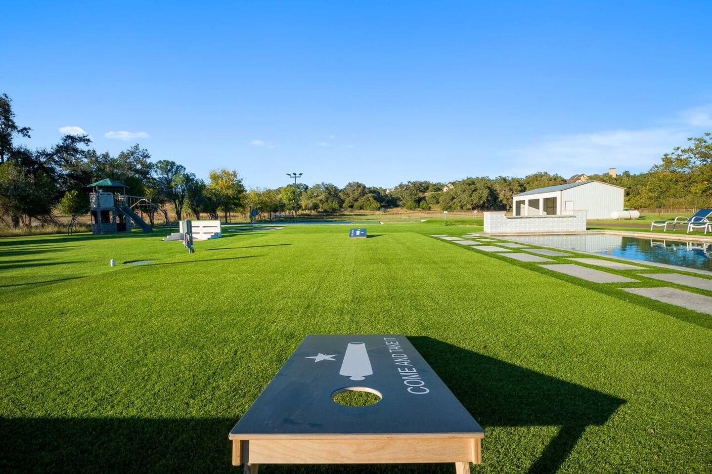 3500 Creek Road Dripping Springs, TX 78620 - Photo 16 of 21 Outdoor lawn featuring a yard and view of wooded area