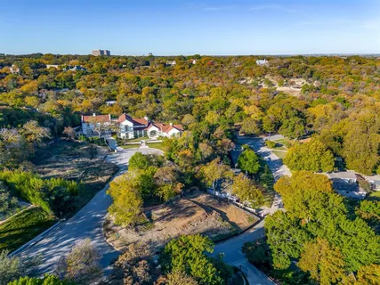 a view of a house with a yard and garden