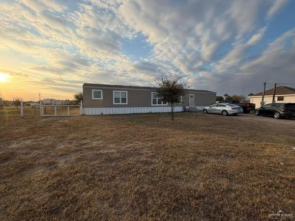 a view of a street with cars parked