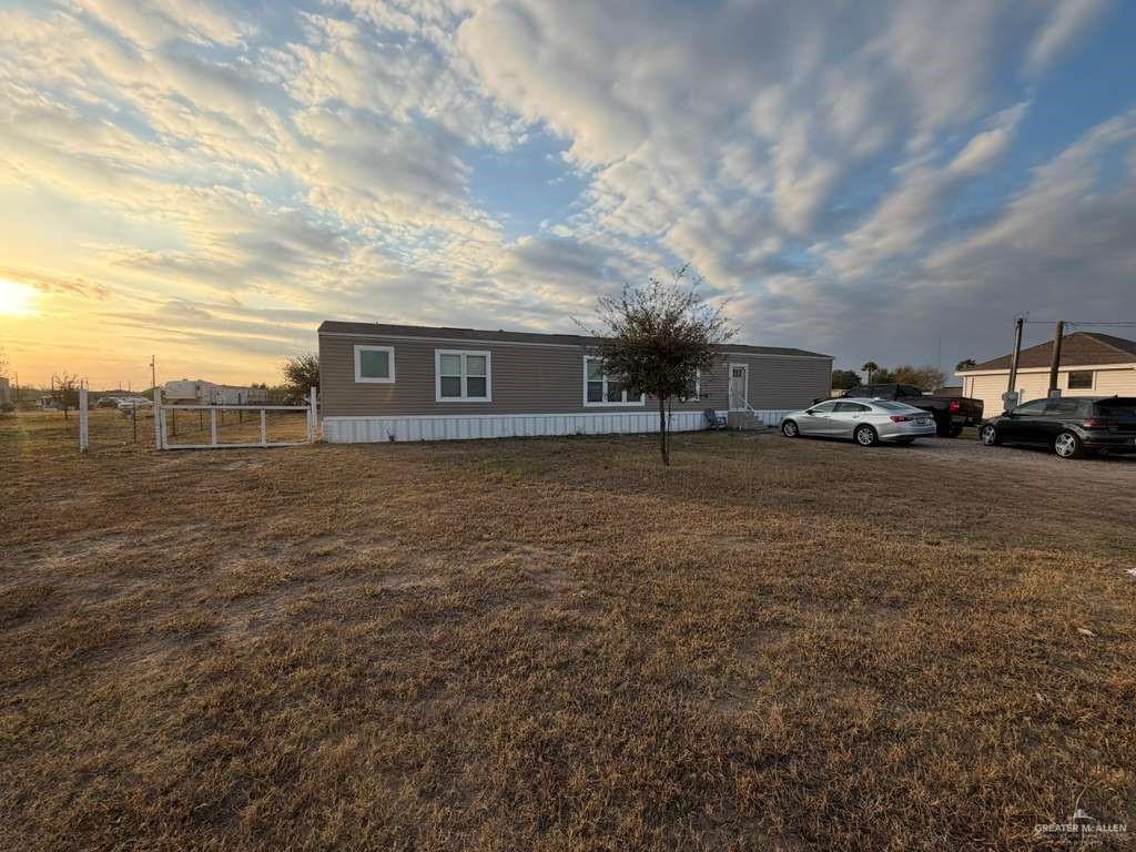 a view of a street with cars parked