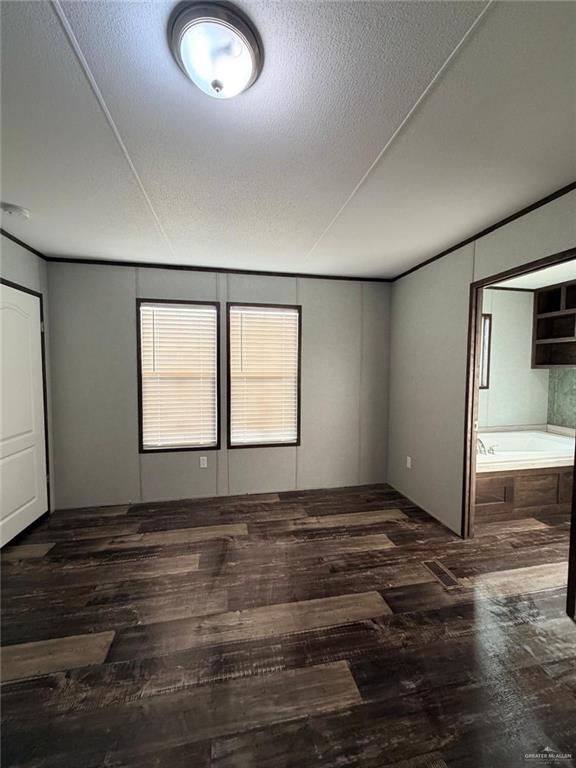 8511 Western Road Mission, TX 78574 - Photo 6 of 15 an empty room with wooden floor and windows