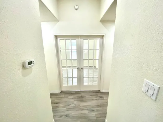 a view of an empty room with windows