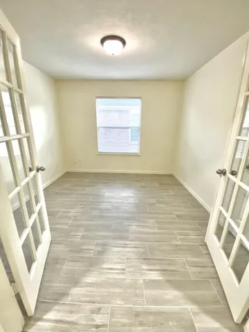 a view of an empty room with a window