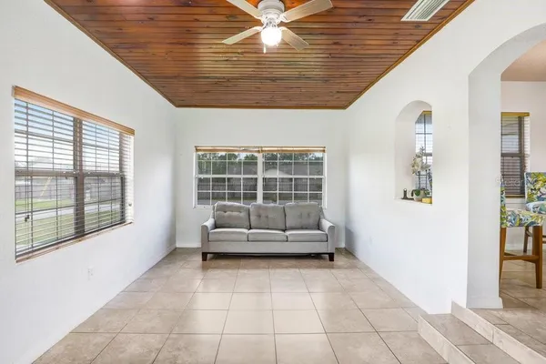 a view of an empty room with windows