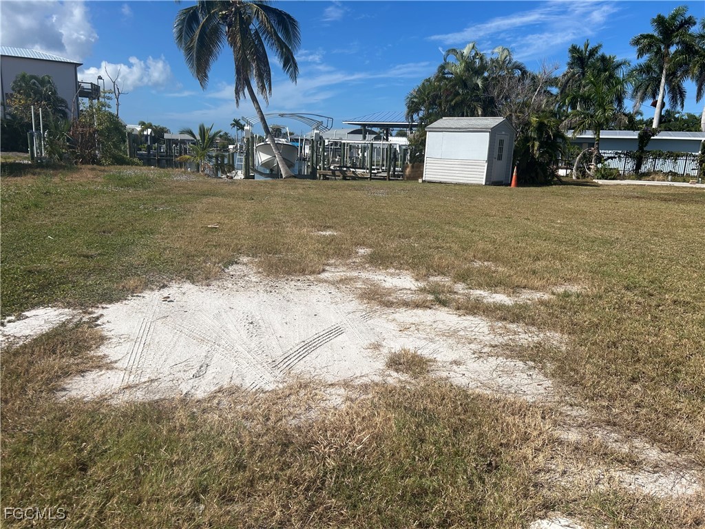 2635 York Road St. James City, FL 33956 - Photo 6 of 6 a front view of a house with a yard and mountain view in back
