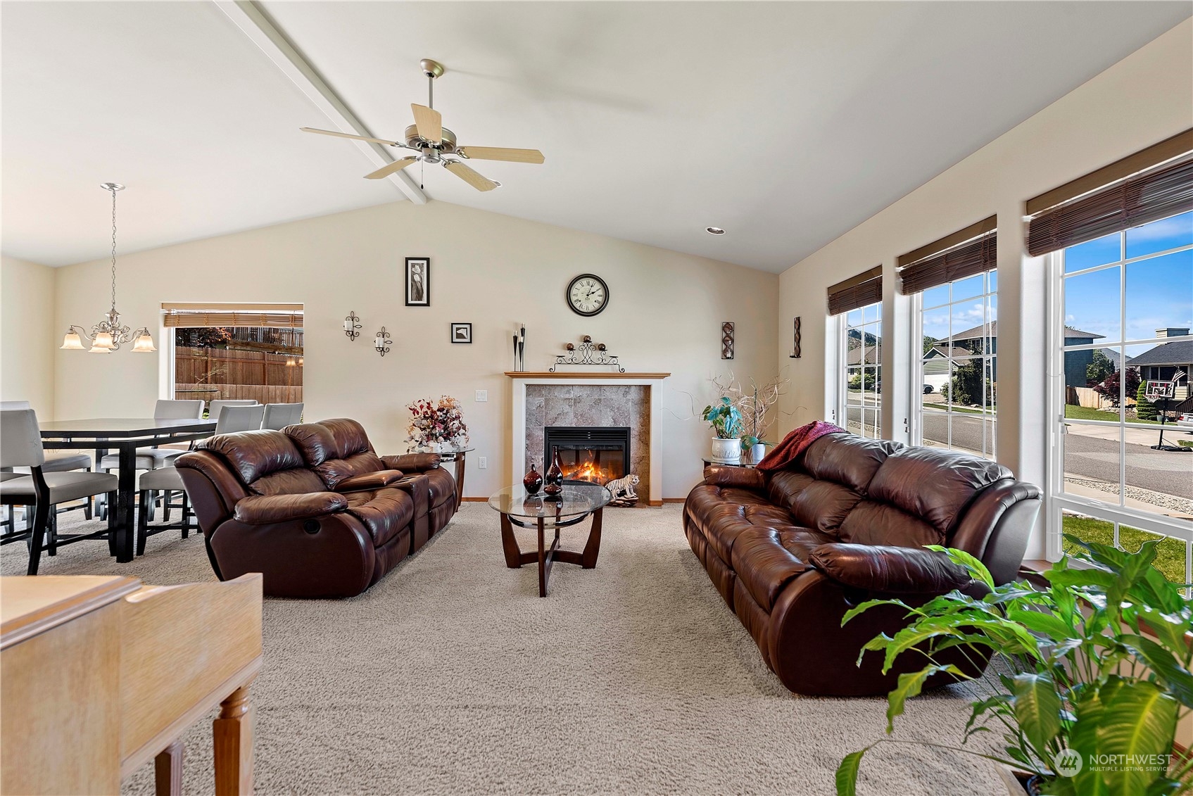 547 Saddle Rock Loop Wenatchee, WA 98801 - Photo 5 of 36 a living room with furniture fireplace and a large mirror