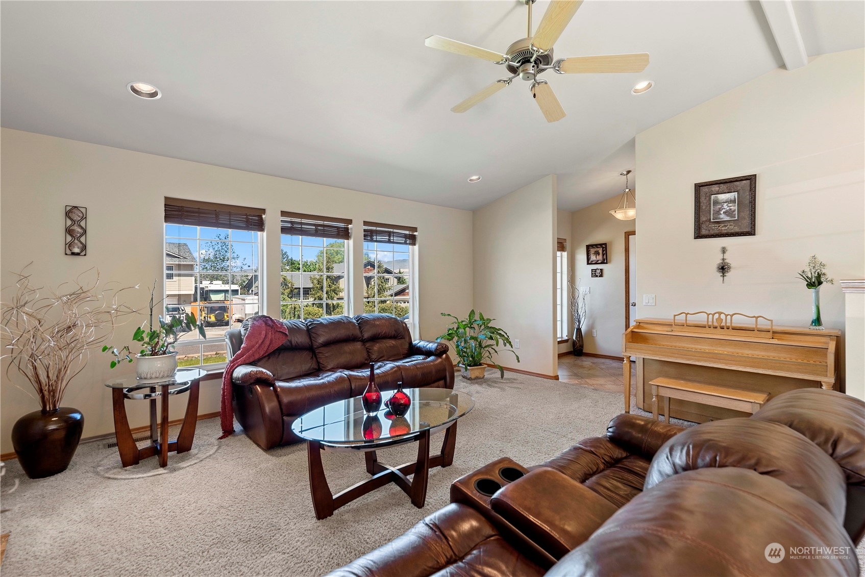 547 Saddle Rock Loop Wenatchee, WA 98801 - Photo 8 of 36 a living room with furniture ceiling fan and a window