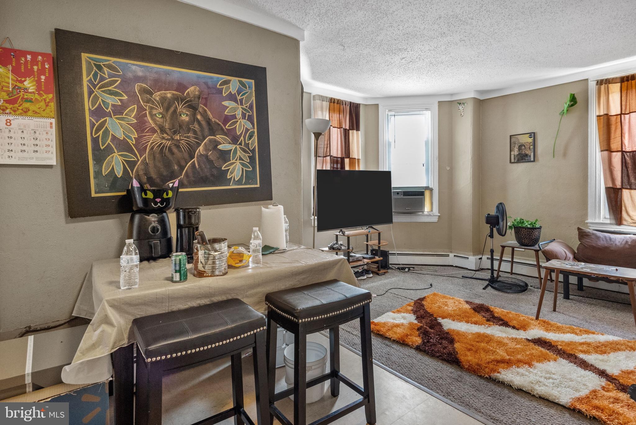 250 Washington Street Morrisville, PA 19067 - Photo 12 of 27 a living room with furniture and a flat screen tv