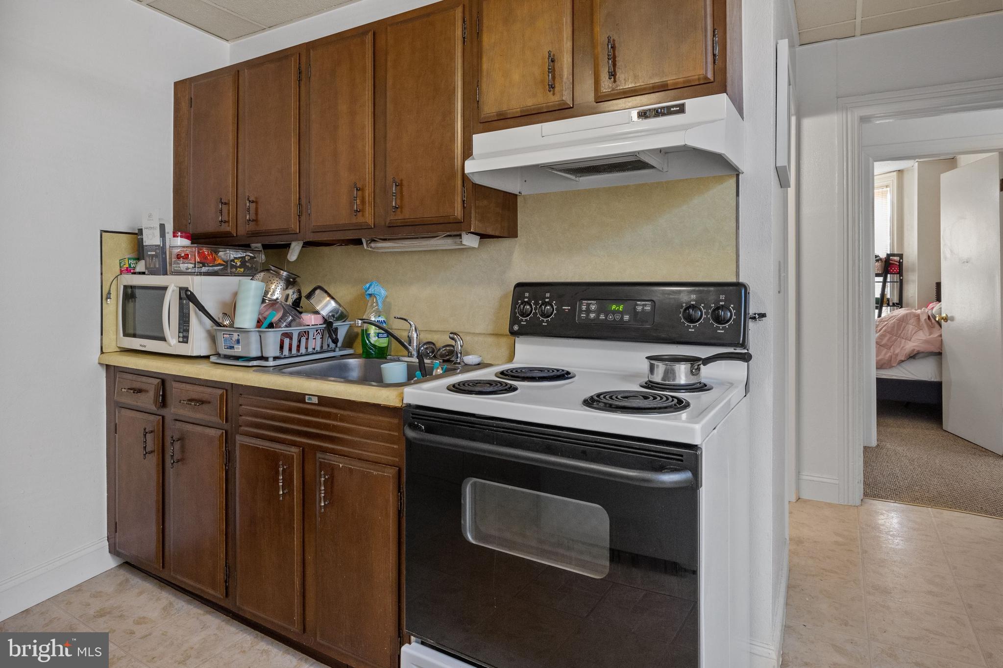 250 Washington Street Morrisville, PA 19067 - Photo 15 of 27 a kitchen with a stove and a sink